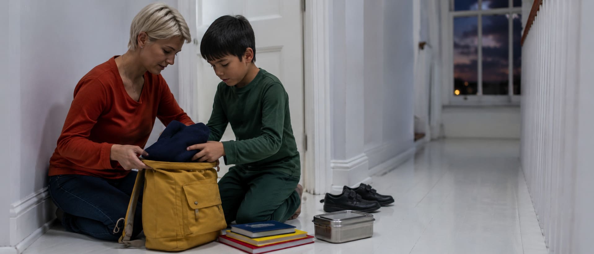 A school bag and packed items prepared the night before