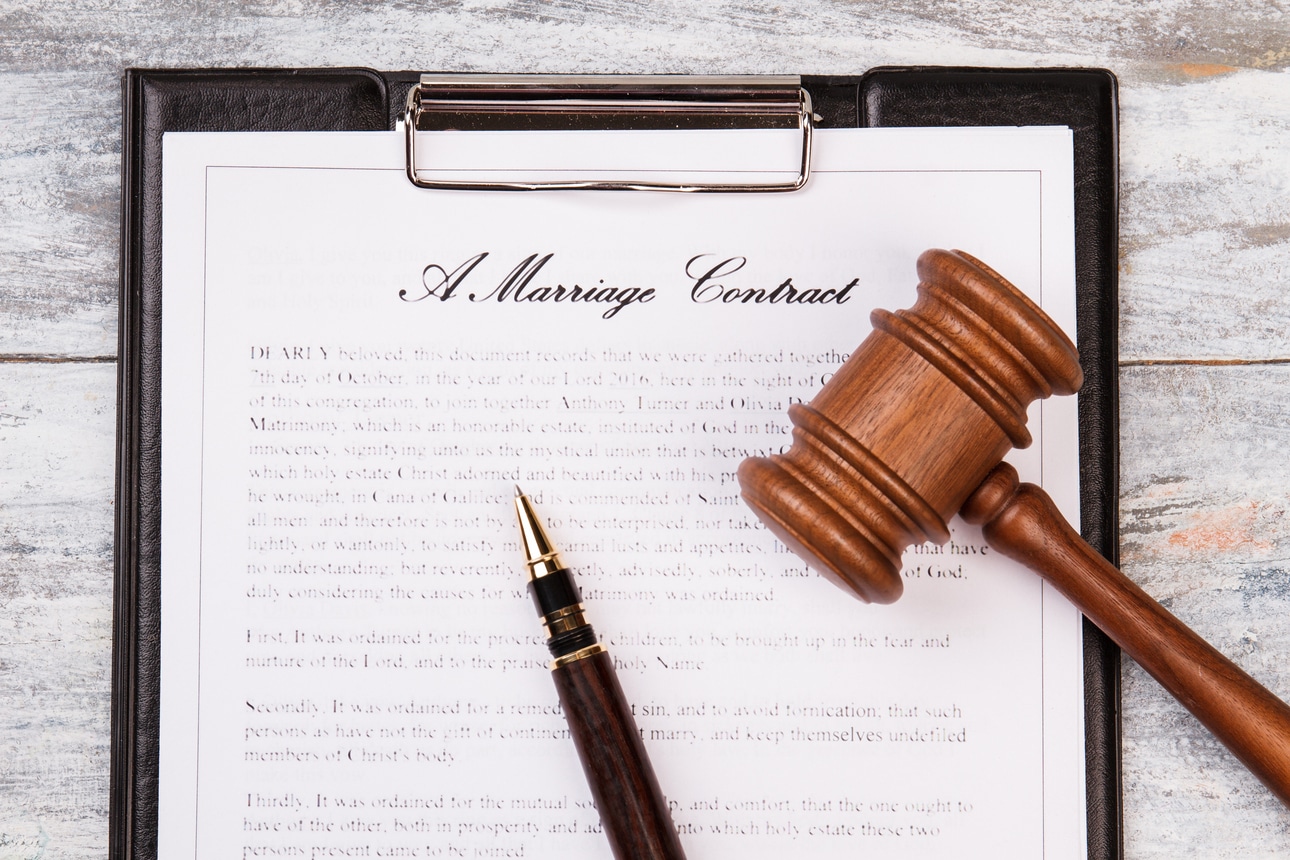 gavel and pen and marriage contract.