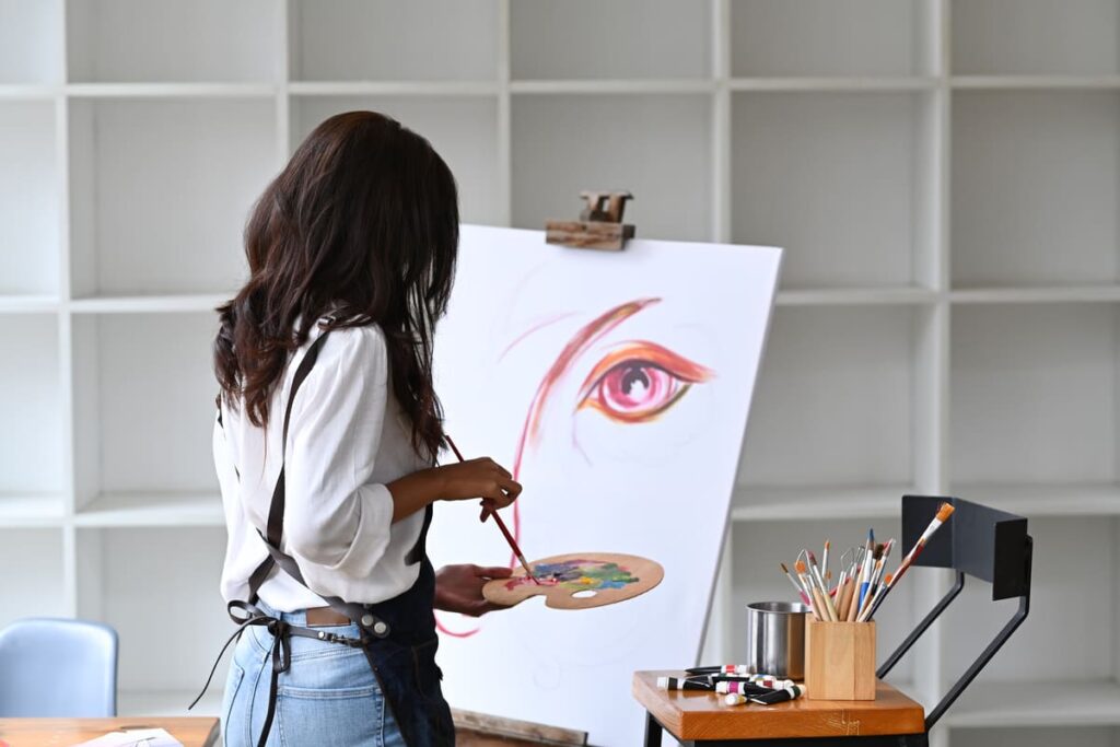 artist woman painting artwork at her workspace 2023 11 27 05 16 54 utc(2)